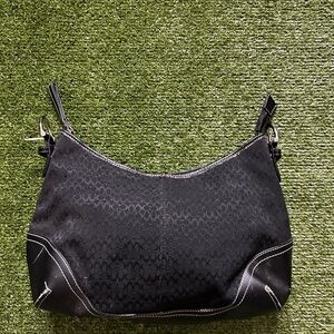 Black Crescent Shoulder Bag with Adjustable Strap and Monogram Pattern